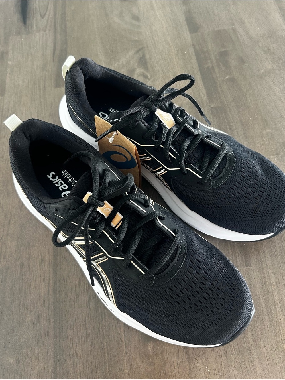 Black and Gold Asics Running Shoes with Gold Accent, Size 10